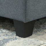 Close-up of a Wise Galleria Modular Sofa leg in black, showcasing a sleek design on a plush rug