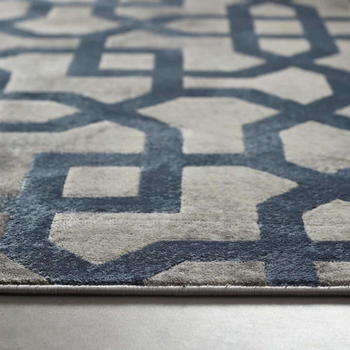 Stylish Moroccan Rug featuring a geometric blue pattern on a soft cream background