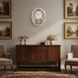 Classic Widdop Motion Clock on a wall above a wooden sideboard in an elegant living room setting
