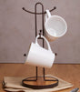 Orsina Mug Tree with a stylish brown finish holding two white mugs on a wooden table