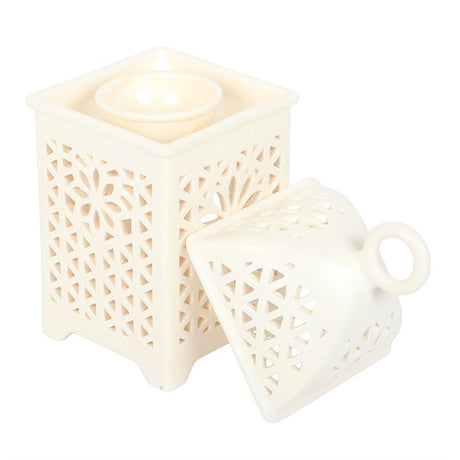 Elegant white multi-purpose burner with intricate cut-out design for home fragrance and decorative use
