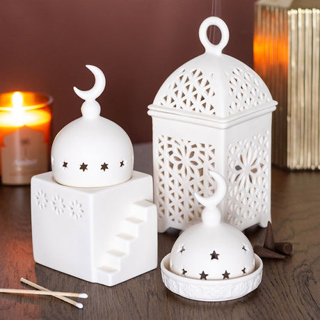 Three decorative ceramic lamps featuring a moon design, perfect for use as a multi-purpose burner