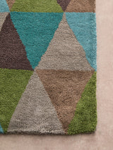 Orsina Multicoloured Rug with a geometric pattern featuring vibrant triangles in various colours