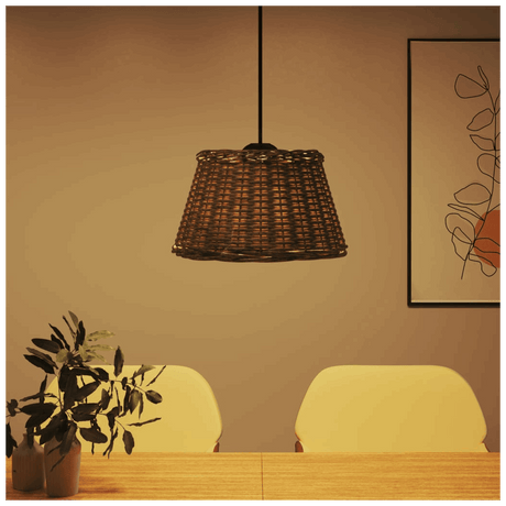 Stylish Woven Rattan Lamp Shade Hanging Above a Wooden Dining Table with Plants