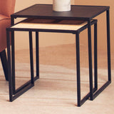 Orsina Nest of Tables featuring a sleek black frame and woven top for modern living spaces