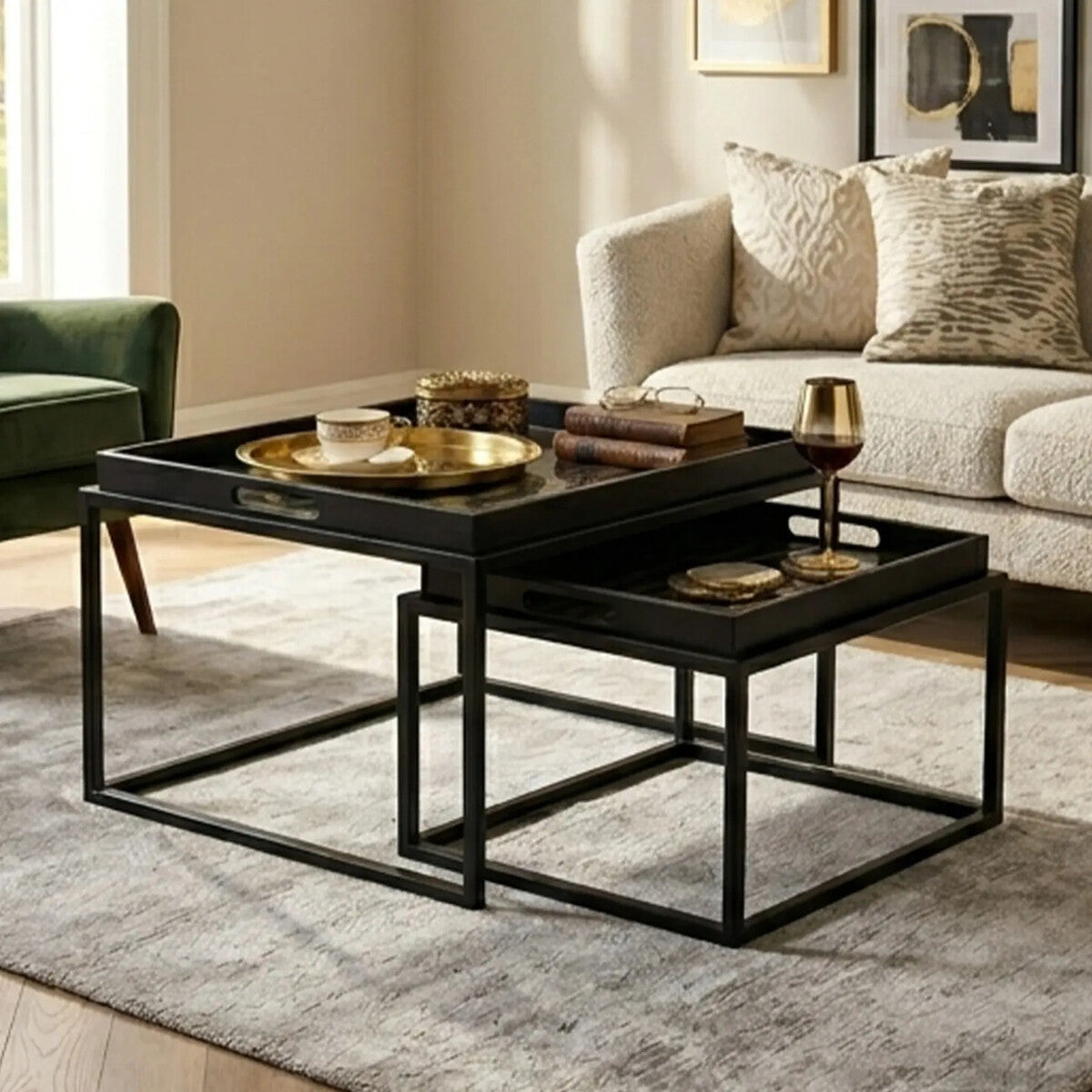 Orsina Nesting Tray Tables in black with gold trays, perfect for modern living room decor
