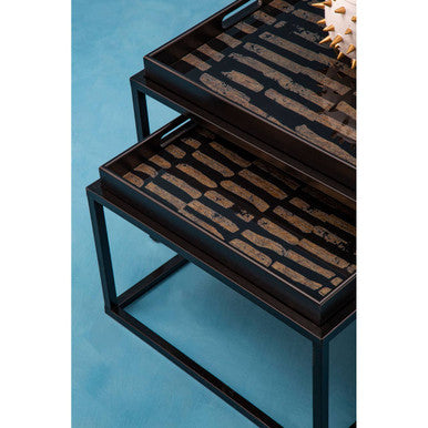 Orsina Nesting Tray Tables featuring a modern design with black and gold patterned surfaces