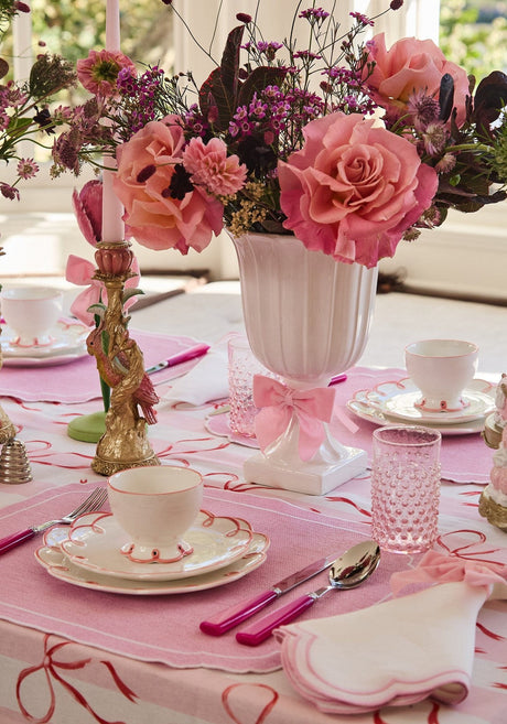 Elegant dining setup featuring a Casa by Josephine Jenno Nibbles Bowl surrounded by floral decorations