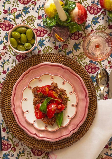 Casa by Josephine Jenno Nibbles Bowl featuring olives on a vibrant floral table setting