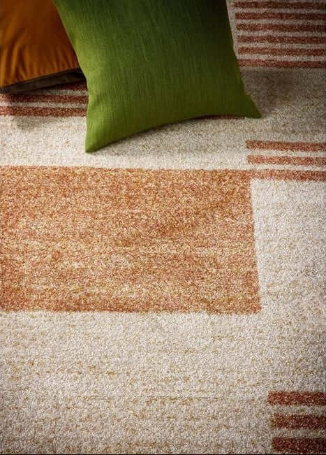 Stylish Nomad Rug in warm tones with patterned design, ideal for cosy living spaces
