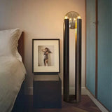 Norda Lamp in a stylish bedroom setting beside a bedside table and framed artwork