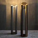 Norda Lamp by Nisu Home featuring a sleek design with a round glass bulb and stylish metallic base
