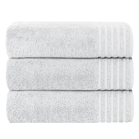 Three soft grey OLIVIA ROCCO bath sheets stacked neatly for luxury bathroom comfort