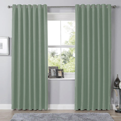 Olivia Rocco Eyelet Curtains in soft green colour, perfect for adding elegance to any room
