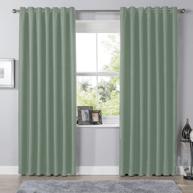 Olivia Rocco Eyelet Curtains in soft green colour, perfect for adding elegance to any room