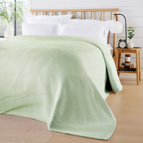 Soft OLIVIA ROCCO Throw Blanket in mint green, perfect for adding warmth to your living space