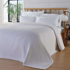 OLIVIA ROCCO Quilted Bedspread in soft white, enhancing a cosy bedroom setting
