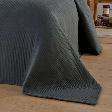 Olivia Rocco Quilted Bedspread in a soft grey colour, perfect for modern bedroom decor