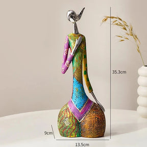Colourful decorative ornament by Nisu Home featuring a stylish figure with intricate patterns
