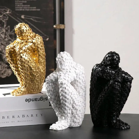 Stylish Nisu Home handwoven ornaments in gold, white, and black, perfect for modern decor
