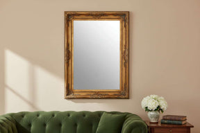 Orsina Wall Mirror with an ornate gold frame, perfect for enhancing your living space