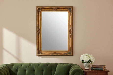 Orsina Wall Mirror with an ornate gold frame, perfect for enhancing your living space