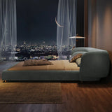 Nisu Home Ottoman Bed in a modern bedroom setting with city view at night