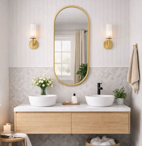 Jobu Home Oval Mirror with a Gold Frame, perfect for modern bathroom decor