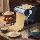 Orsina Pasta Maker with rolled out fresh pasta, surrounded by flour and eggs in a kitchen setting