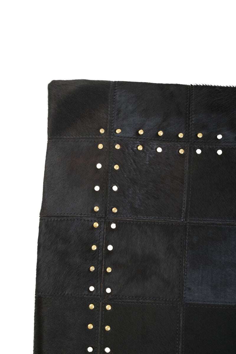 Orsina Patchwork Cushion in black with decorative studs for stylish home decor
