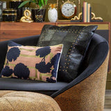 Stylish Patchwork Cushion on a modern chair, featuring vibrant patterns and textures for home decor