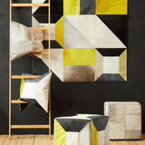Orsina Patchwork Cushion in vibrant colours displayed on a wooden ladder and stylish decor