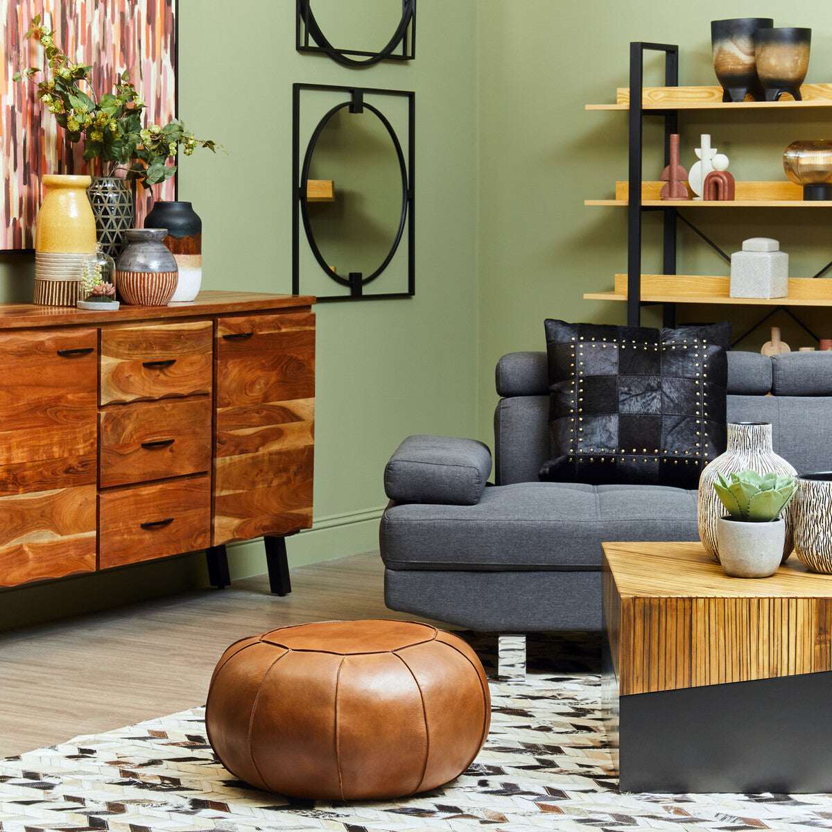 Stylish living room featuring a Patchwork Cushion on a grey sofa with wooden furniture