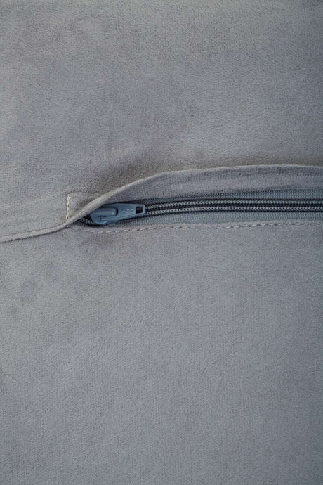 Close-up of Orsina Patchwork Cushion showing the sleek zip closure detail