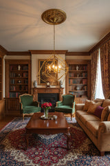 Stylish Orsina Pendant Light hanging in a luxurious living room with green chairs and wooden decor