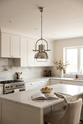 Orsina Pendant Light in a modern kitchen with white cabinetry and marble countertops