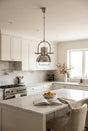 Orsina Pendant Light in a modern kitchen with white cabinetry and marble countertops