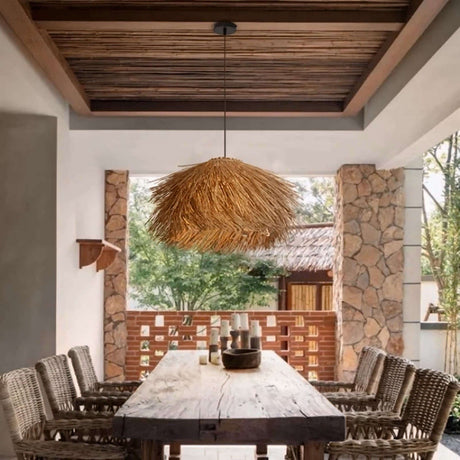 Stylish Nisu Home Pendant Light with a natural straw design, perfect for outdoor dining spaces