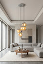 Orsina Pendant Lights featuring five glass globes in a modern living room setting