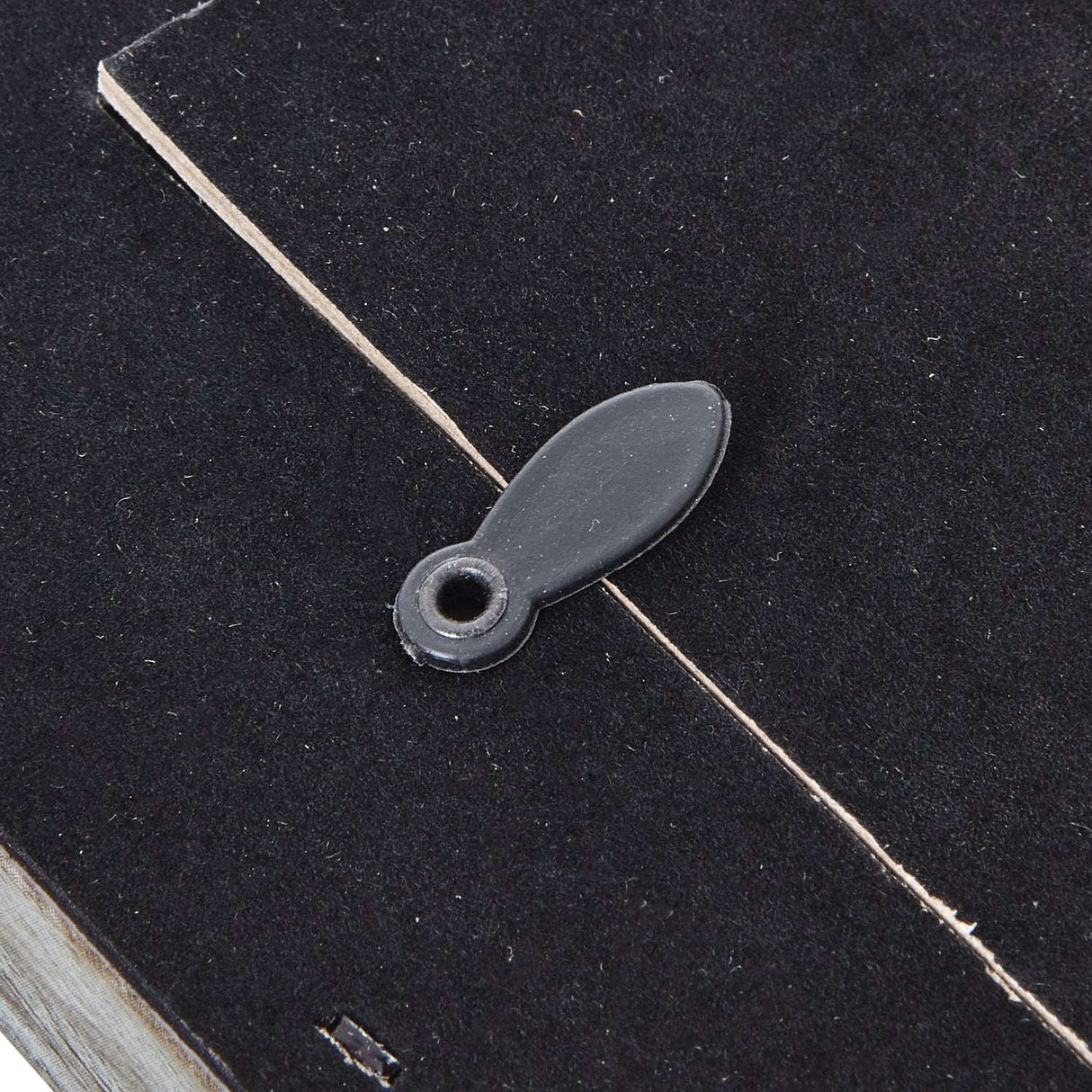 Close-up of a black photo frame detail featuring a secure closure for easy photo insertion