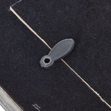 Close-up of a black photo frame detail featuring a secure closure for easy photo insertion