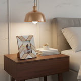 Orsina Photo Frame in a stylish design displayed on a bedside table with books and a lamp
