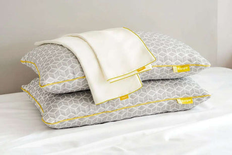 Brightr Sleep adjustable pillows with a grey geometric design and a white cover, paired with a Pillow Protector