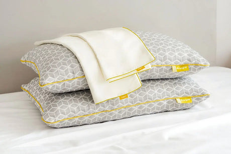 Brightr Sleep adjustable pillows with a grey geometric design and a white cover, paired with a Pillow Protector
