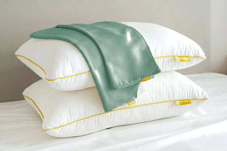 Brightr Sleep adjustable hypo-allergenic pillows with a green Pillowcase Bundle on top for optimal comfort