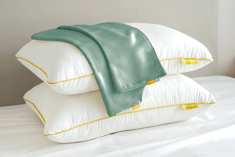 Brightr Sleep adjustable hypo-allergenic pillows with a green Pillowcase Bundle on top for optimal comfort