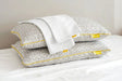 Brightr Sleep Memory Foam Hybrid Pillow with a Pillowcase Bundle on a bed for optimal neck support