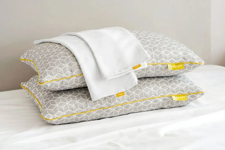 Brightr Sleep Memory Foam Hybrid Pillow with a Pillowcase Bundle on a bed for optimal neck support