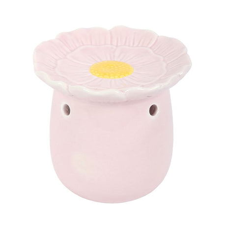 Pink ceramic oil burner in flower shape for fragrant essential oils and home aromatherapy