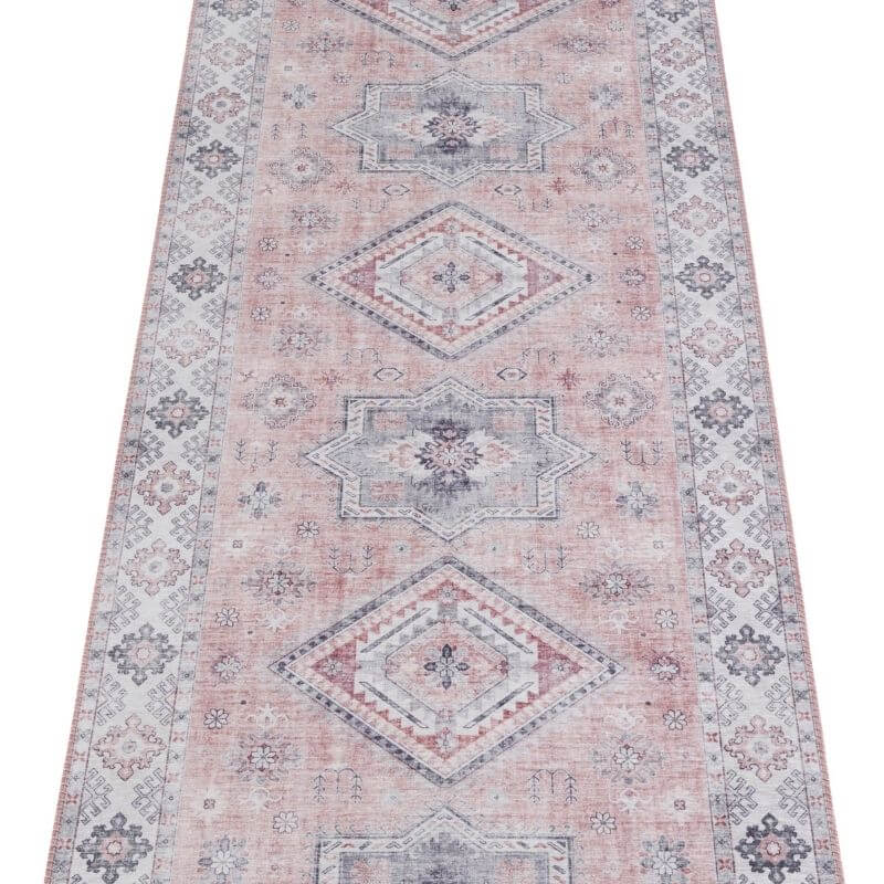 Elegant pink rug with intricate geometric patterns for stylish home decor